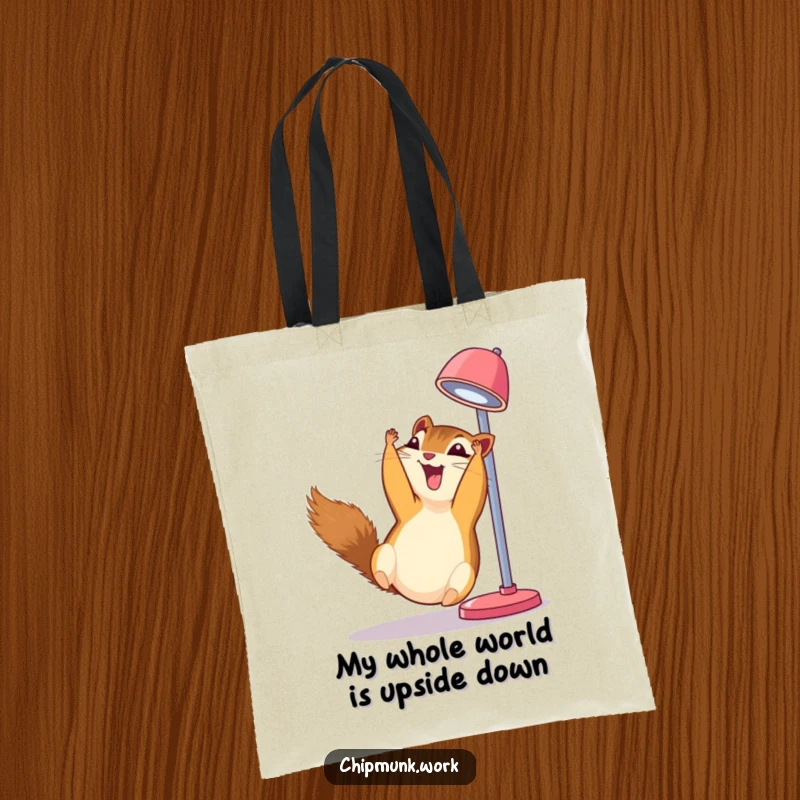 Funny chipmunk tote bag, dangling upside down from a desk lamp, erupting in uncontrollable, silent giggles.